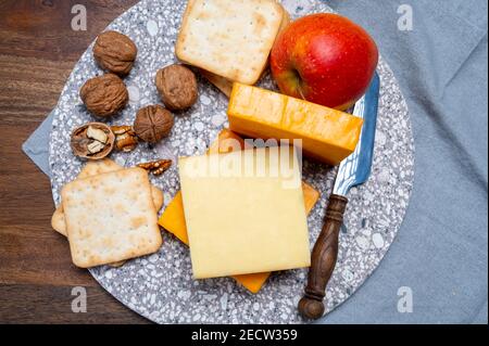 Cheese collection, orange and yellow smoked British cheese from England close up Stock Photo