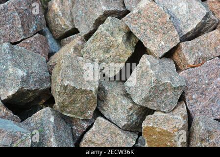 Paving stones, square stones for decorating from natural granite, very bright and beautiful. Stock Photo