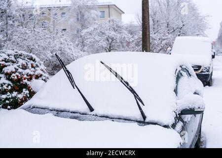 Folded down windshield wipers on a car , so that they do not freeze Stock Photo