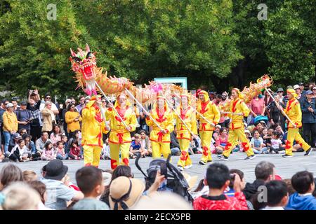 (210214) -- CHRISTCHURCH, Feb. 14, 2021 (Xinhua) -- Dragon dance is performed during a Chinese Lunar New Year parade in Christchurch City of New Zealand, Feb. 14, 2021. New Zealand's Christchurch ushered in the Year of the Ox with multiple cultural events, highlighted by a Lunar New Year theme street parade on Sunday with traditional dancers and musicians, dragons, lions and much more. (Photo by Li Xiaogang/Xinhua) Stock Photo