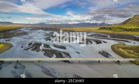Breathtaking drone landscape view of a bridge and the riverbed beneath in South Iceland Stock Photo
