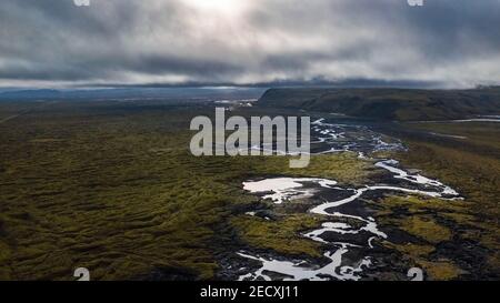 Breathtaking drone landscape view of a mountain and the plains along with a riverbed in South Iceland Stock Photo