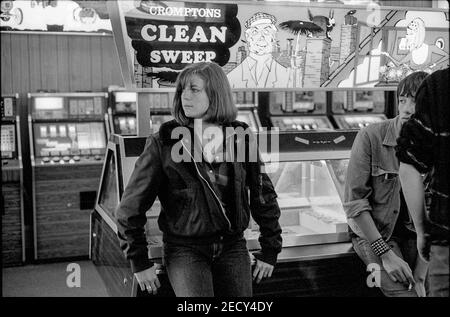 Teenage Girl Leaning Against Clean Seep machine Stock Photo