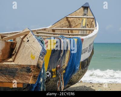 Africa Fishing boat with blue fishing nets in Ada Foah Ghana. Nice area with old traditional fishing. Stock Photo