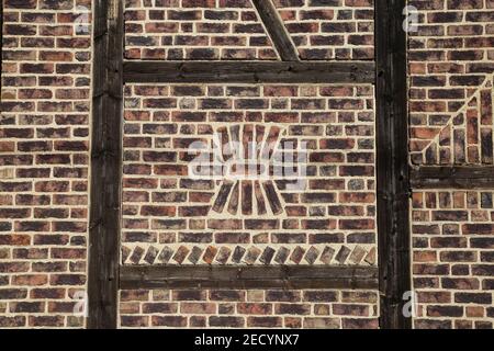 Closeup of isolated red half timbered farm house brick wall - Germany Stock Photo