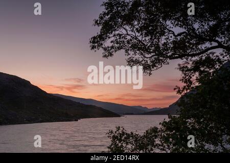 Dawn breaking over Llyn Ogwen, Snowdonia, North Wales Stock Photo