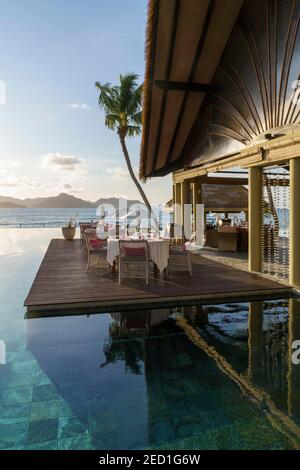 Poolside terrace, Le Domaine de L'Orangeraie Resort, La Digue, Seychelles Stock Photo