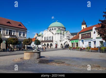 Jewish synagogue on the main square with Aquarius fountain Vodnik, Trencin, Slovakia Stock Photo