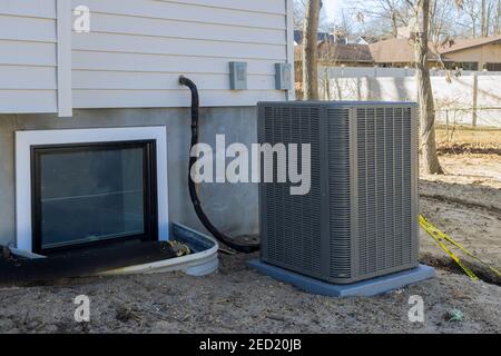 Air conditioning system unit installed outside facade of the new house the air conditioner with freon Stock Photo