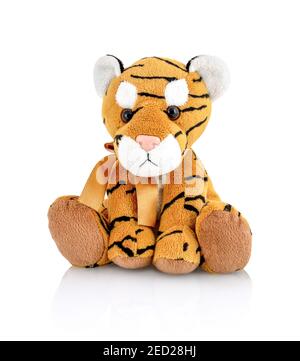 Tiger plushie doll isolated on white background with shadow reflection. Playful bright brown puppy toy. Plush stuffed puppet on white backdrop. Fluffy Stock Photo