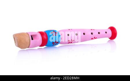 Pink wooden flute isolated on white background with shadow reflection, clipping path, vector path. Colorful recorder for kids. Woodwind musical instru Stock Photo