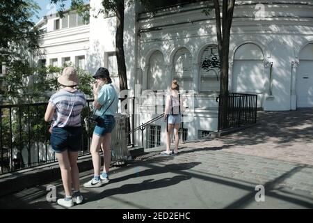 MONTMARTRE, PARIS - 29TH JUNE 2019: Tourists and locals on Rue du Cardinal Dubois beside the Funiculaire in Montmartre. Stock Photo