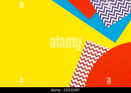 Abstract geometric fashion papers texture background in yellow, red, blue colors. Top view, flat lay Stock Photo