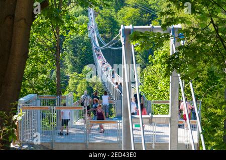 Rappbode Germany - May 27. 2017: Tourists enjoying the view from the suspension bridge near Rappbode dam in Germany Stock Photo
