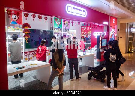 Nintendo store with people in Shenzhen China Stock Photo