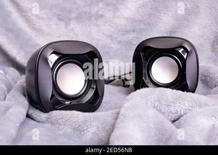 Two small speakers on a gray background close up Stock Photo