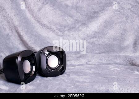 Two small speakers on a gray background copy space Stock Photo