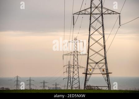 Brighton, February 14th 2021: Electrical pylons in Mile Oak in East Sussex Credit: Andrew Hasson/Alamy Live News Stock Photo