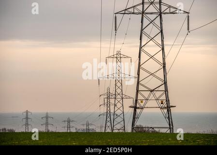 Brighton, February 14th 2021: Electrical pylons in Mile Oak in East Sussex Credit: Andrew Hasson/Alamy Live News Stock Photo