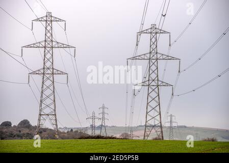 Brighton, February 14th 2021: Electrical pylons in Mile Oak in East Sussex Credit: Andrew Hasson/Alamy Live News Stock Photo