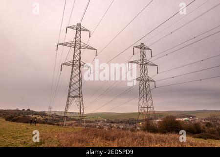 Brighton, February 14th 2021: Electrical pylons in Mile Oak in East Sussex Credit: Andrew Hasson/Alamy Live News Stock Photo