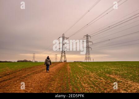 Brighton, February 14th 2021: Electrical pylons in Mile Oak in East Sussex Credit: Andrew Hasson/Alamy Live News Stock Photo