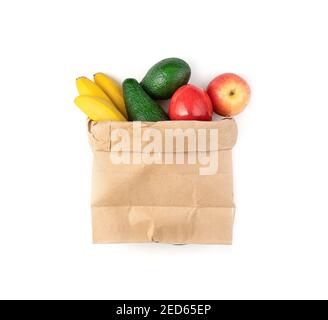 The bag is filled with different fresh fruits on a white background. Stock Photo