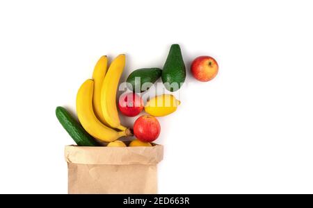 Fresh, juicy bananas, avocados, apples and lemons are isolated on a white background. Stock Photo