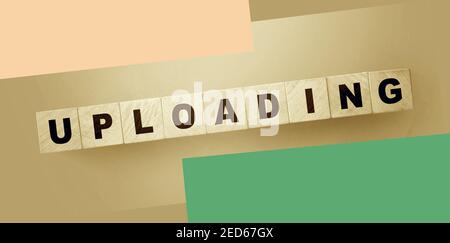 uploading word on wooden cubes. Online downloadable Internet resources concept Stock Photo