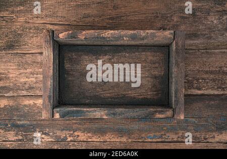 An empty wooden box on a wooden background. Top view. Stock Photo
