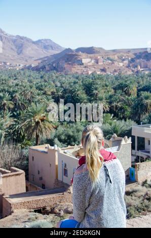 blonde tourist girl in Morocco taking a rest in a local small village Stock Photo
