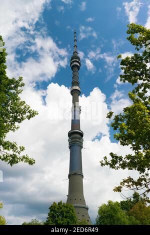 Ostankino tower on blue sky framed by trees Stock Photo
