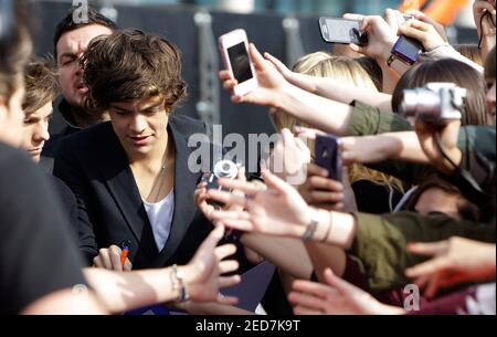 Harry Styles of One Direction seen out and about in Hampstead with friends.  He signed autographs and posed for photographs for fans. London, England -  05.07.12 Stock Photo - Alamy