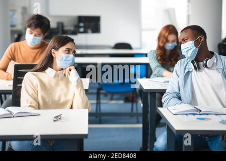 International students wearing medical masks and talking Stock Photo