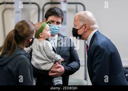 U.S President Joe Biden greets Ret. U.S. Marine Cpl. William Kiernan, his wife Leah, and their daughter Madison during a visit to Walter Reed National Military Medical Center January 29, 2021 in Bethesda, Maryland. Cpl. Kiernan was injured in 2010 while deployed to Afghanistan where he suffered a right below-knee amputation from an improvised explosive device attack. Stock Photo