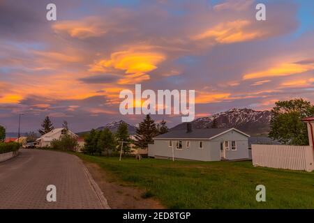 The sunset is reflected in the clouds near island of Hrisey in IcelandThe sunset is reflected in the clouds near island of Hrisey in Iceland Stock Photo