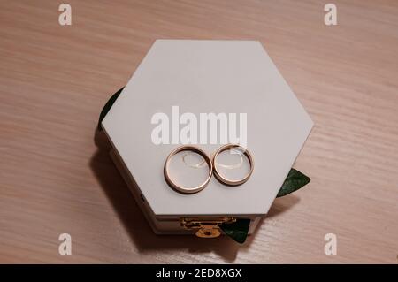 Wedding gold rings on white box Stock Photo