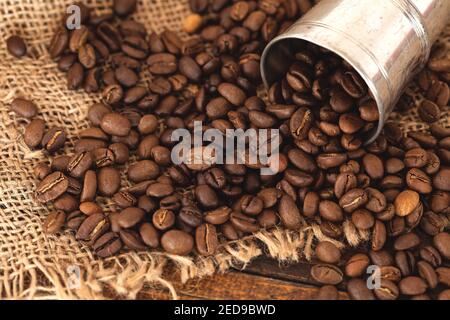 Coffee beans on burlap background Stock Photo