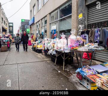 Brooklyn NY, USA - February 14, 2021: Street vendors, some of them illegal, overtaking streets of Bensonhurst trying to survive during pandemic time. Stock Photo