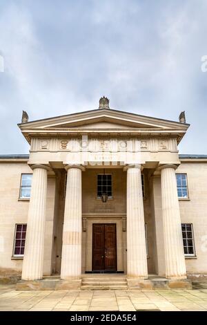 Neo-classical style portico with pediment and doric columns at the Maitland Robinson Library, Downing College, Cambridge, UK