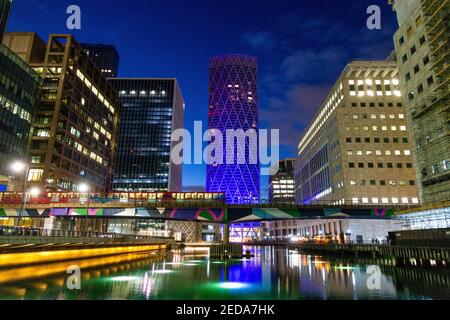 5 December 2020 - London, UK, View over Middle Dock in Canary Wharf, Connected by Light curated light art installations on display, Ghost Trees by Tom Stock Photo