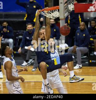 Newark, New Jersey, USA. 14th Feb, 2021. Marquette Golden Eagles forward Theo John (4) dunks in the second half at the Prudential Center in Newark, New Jersey. Seton defeated Marquette 57-51. Duncan Williams/CSM/Alamy Live News Stock Photo