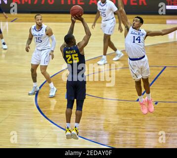 Newark, New Jersey, USA. 14th Feb, 2021. Marquette Golden Eagles guard Koby McEwen (25) shoots over Seton Hall Pirates guard Jared Rhoden (14) in the second half at the Prudential Center in Newark, New Jersey. Seton defeated Marquette 57-51. Duncan Williams/CSM/Alamy Live News Stock Photo