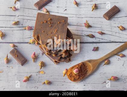 Chocolate and roses bar soap on a white wooden background , handmade soap Stock Photo