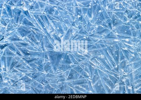 texture frozen natural blue ice crystals. Ice patterns on the water surface of frozen river Stock Photo