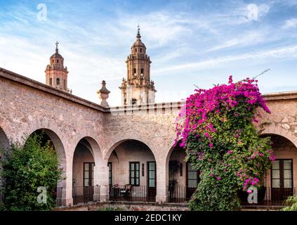 The colonial Hotel Soledad with the towers of the cathedral in the background, Morelia, Michoacan, Mexico. Stock Photo