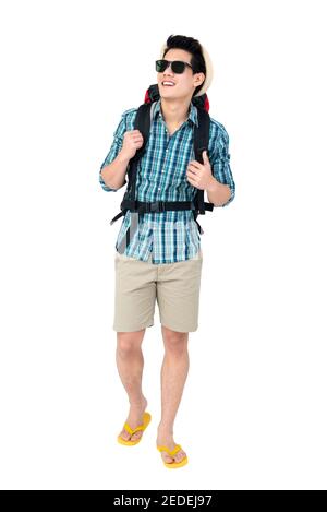 Portrait of handsome young Asian man tourist backpacker isolated on white background studio shot, beach traveling concept Stock Photo