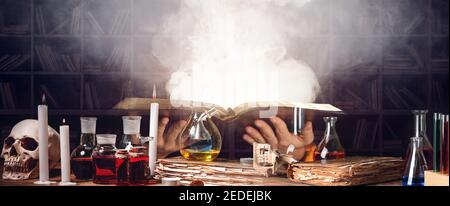 Alchemist making potion in laboratory Stock Photo