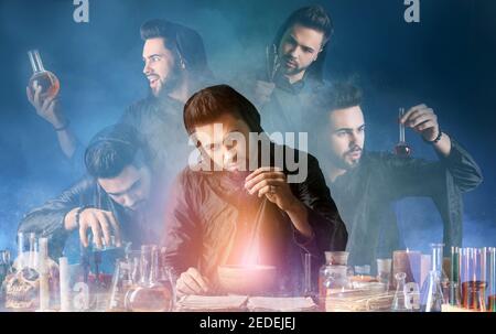 Male alchemist making potion in laboratory Stock Photo