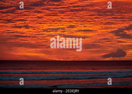 Incredible fiery sunset over the Pacific Ocean taken from Santa Teresa Beach, Costa Rica Stock Photo